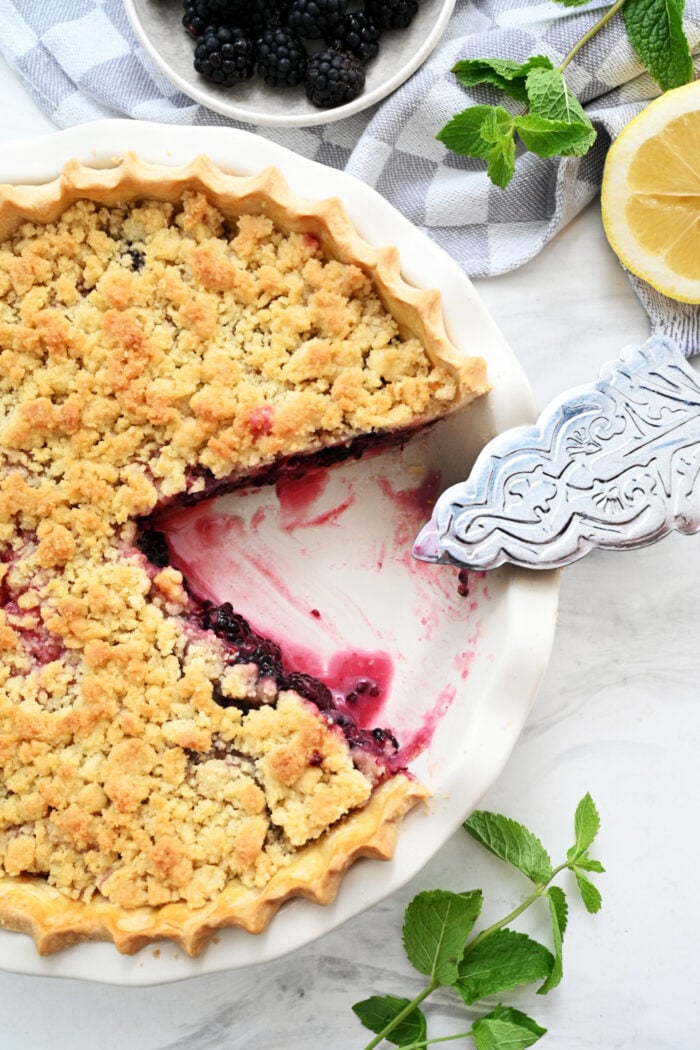 cutting into a berry pie