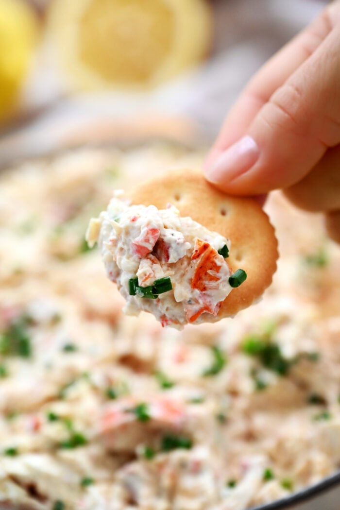 bite of dip on Ritz cracker