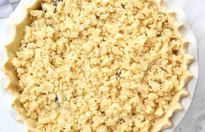 adding crumble to a pie
