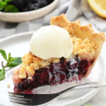 a piece of berry pie with melted ice cream