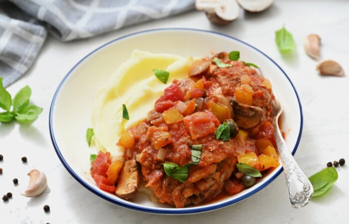 a serving of Chicken Cacciatore with mashed potatoes