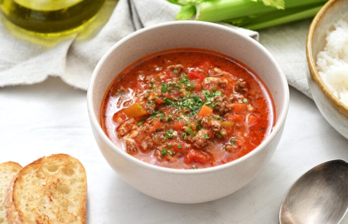 a bowl of Roasted Red Pepper and Gouda Cheese Soup