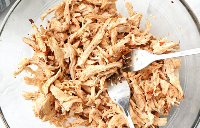 shredding chicken with 2 forks