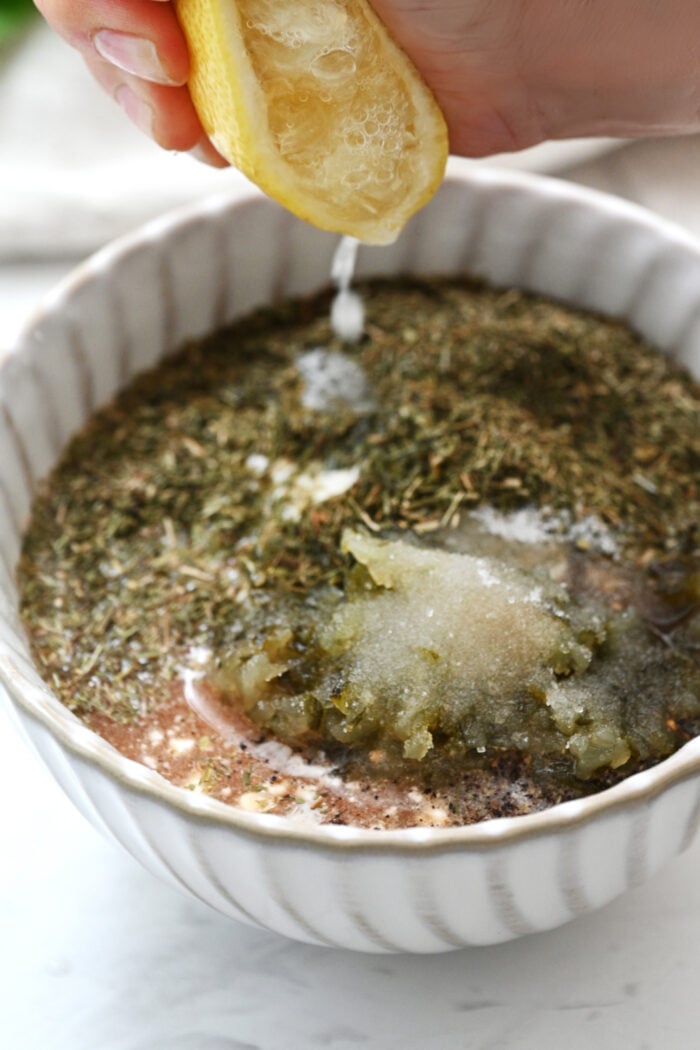 squeezing lemon into a dressing