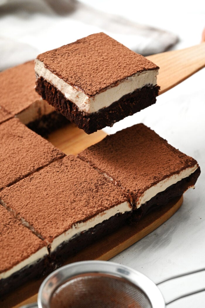 serving a piece of Tiramisu Brownie
