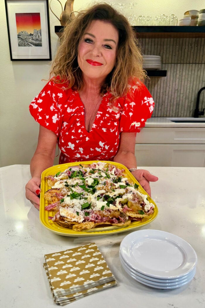 woman holding an Italian Nachos