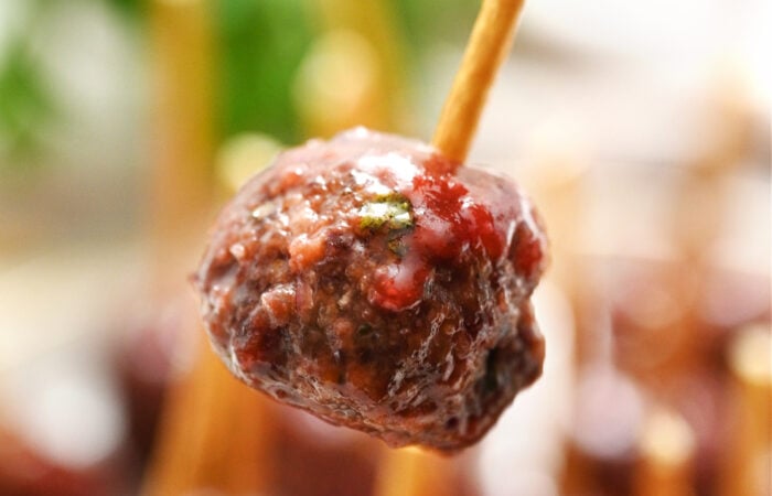 a meatball with pretzel stick