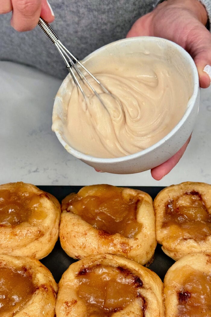 stirring icing for cinnamon rolls