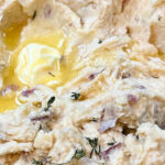 melted butter on potatoes