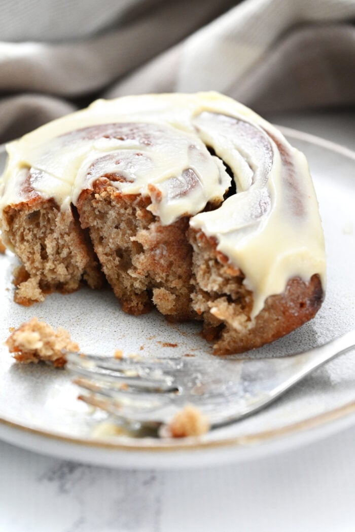 a fork bite of a protein cinnamon roll