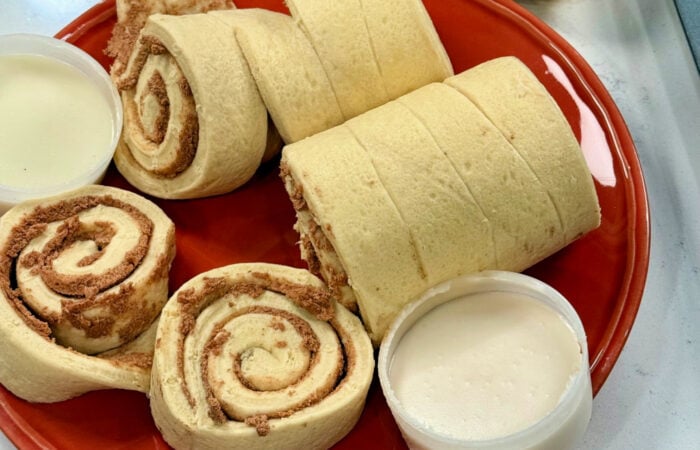 opening a can of cinnamon rolls with icing