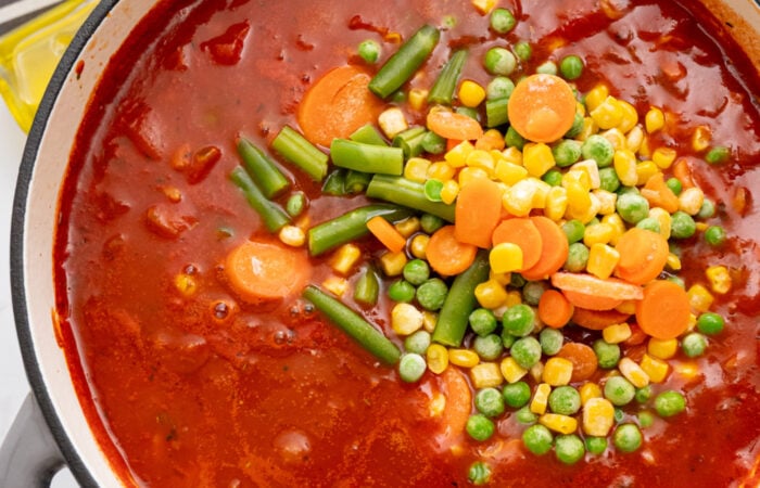 adding mixed veggies to soup