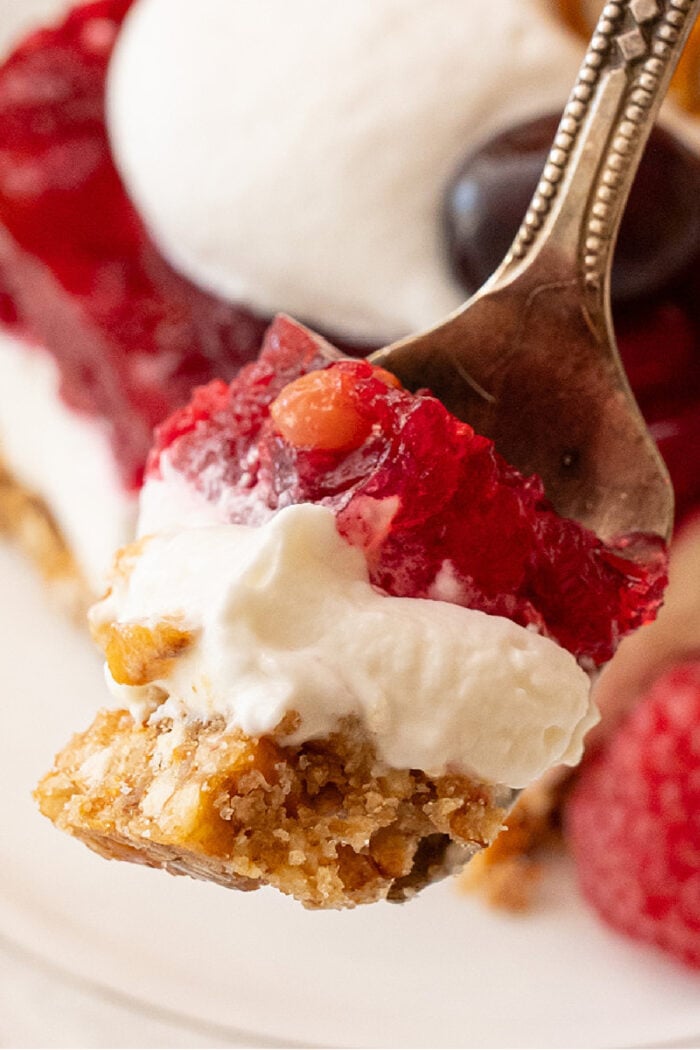 layers of cranberry salad with pretzel crust