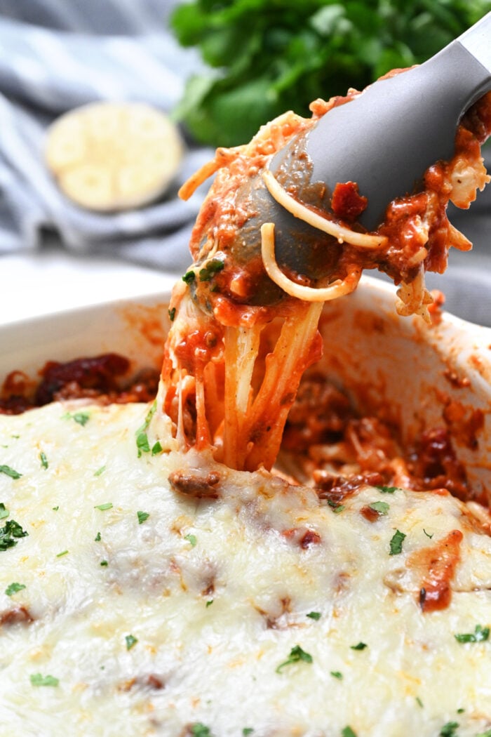 serving spaghetti with alfredo