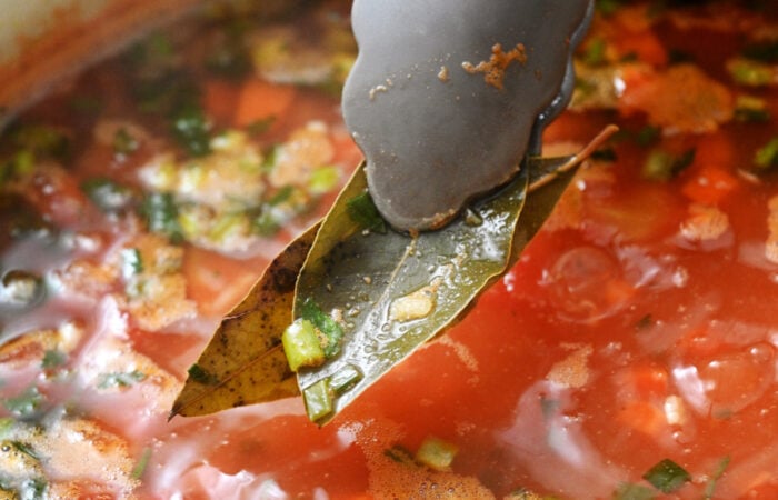 adding a bay leaf to soup