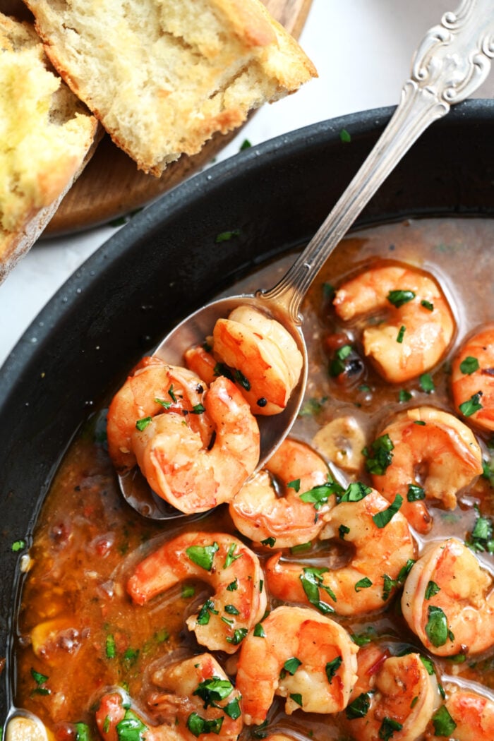 a spoonful of Spicy Shrimp with sauce