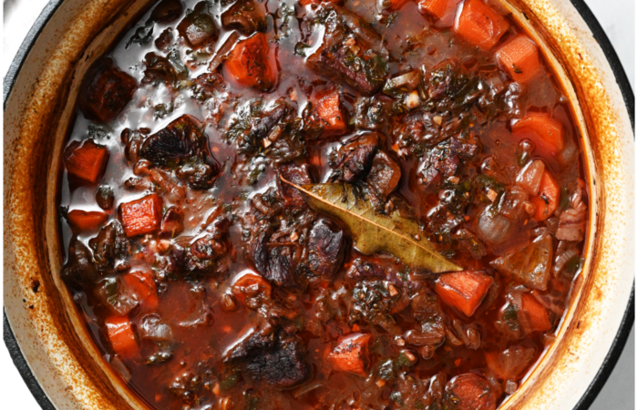 adding a bay leaf to stew