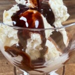 adding chocolate sauce to ice cream