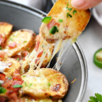 taking a bite of Irish Nacho