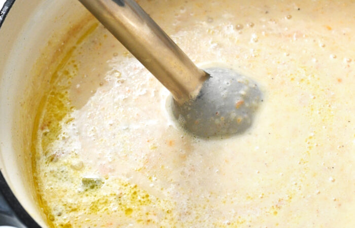 immersion blender blending potato soup
