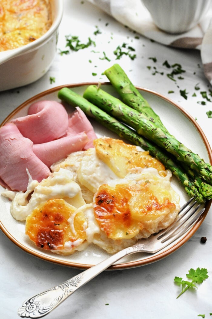a plate of Creamy Scalloped Potatoes