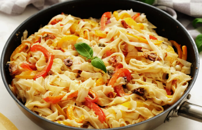 cooking a skillet of noodles