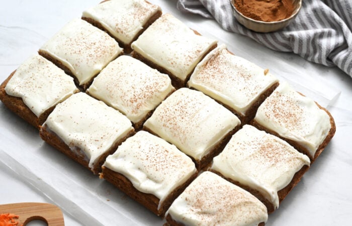 Carrot Cake cut into bars with thick frosting