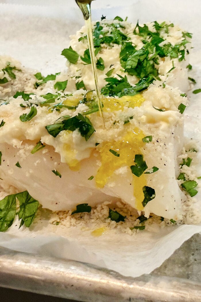 drizzling olive oil on fish