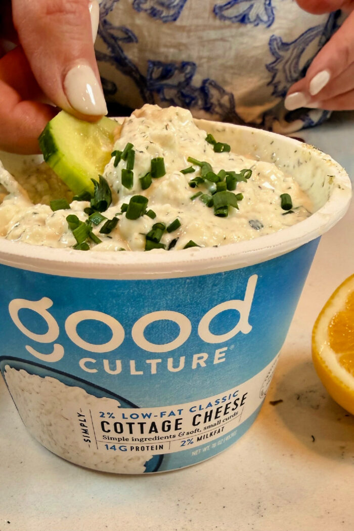 scooping a cucumber in Cottage Cheese Ranch Dip