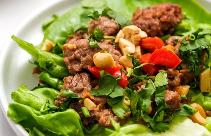 making a lettuce wrap with meat