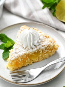 a piece of Lime Curd Cake with whipped cream