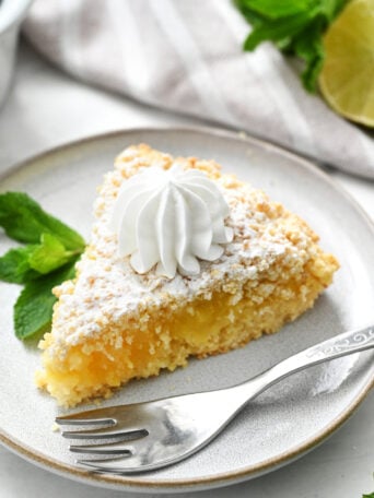 a piece of Lime Curd Cake with whipped cream