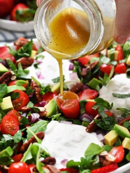 pouring lemon dressing