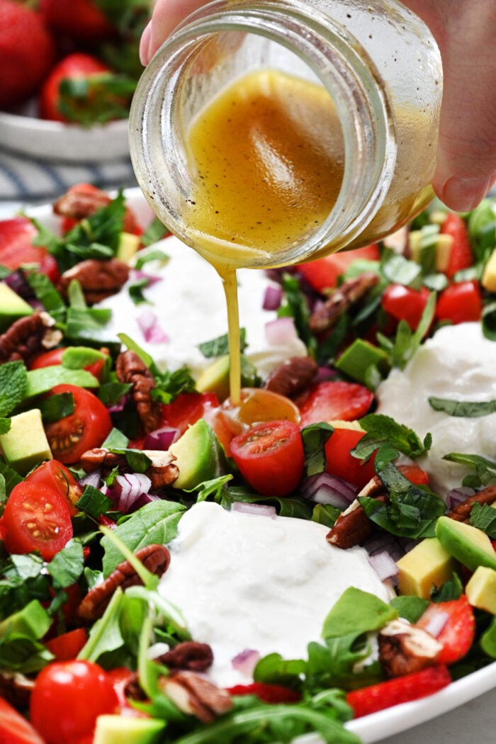 pouring lemon dressing
