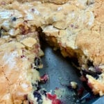 cutting into a round coffee cake