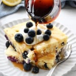 pouring syrup on pancakes