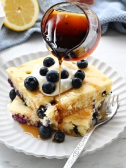 pouring syrup on pancakes