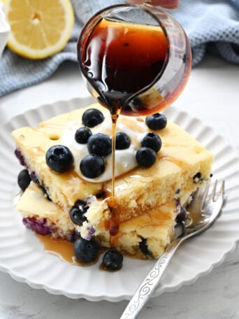 pouring syrup on pancakes