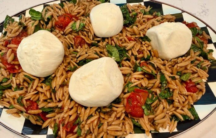 adding burrata to a salad