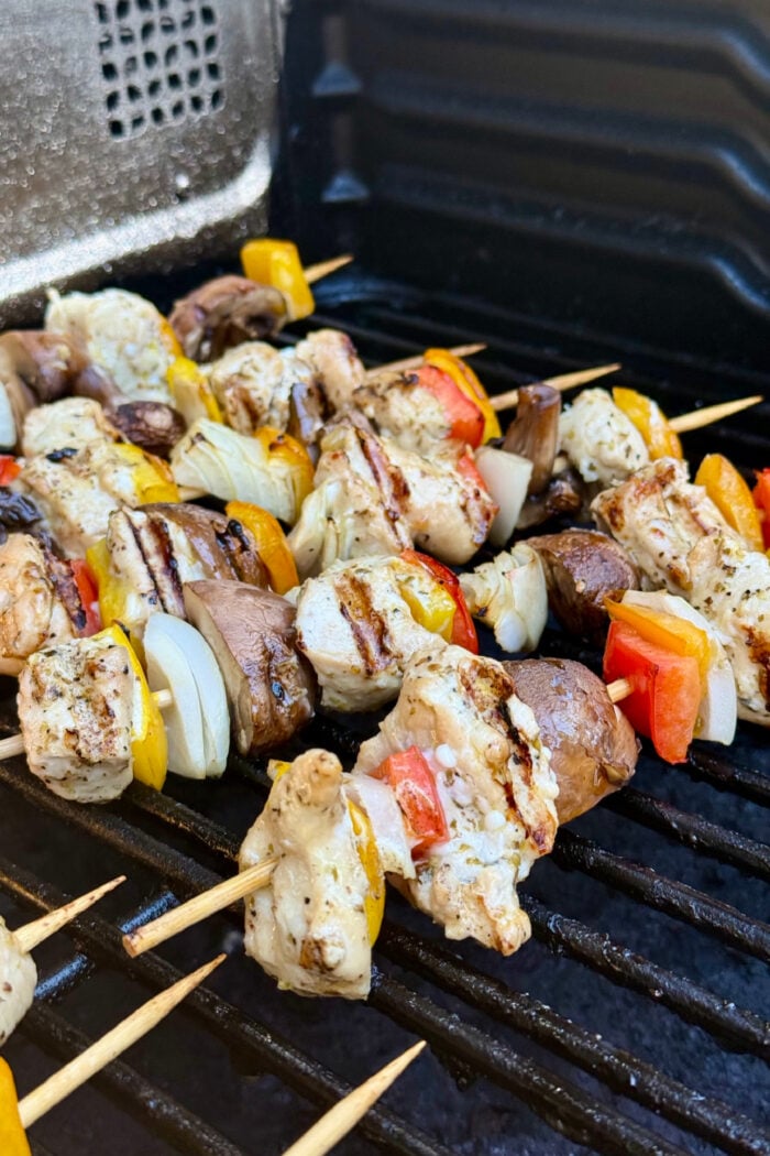 grilling chicken kebabs on Traeger