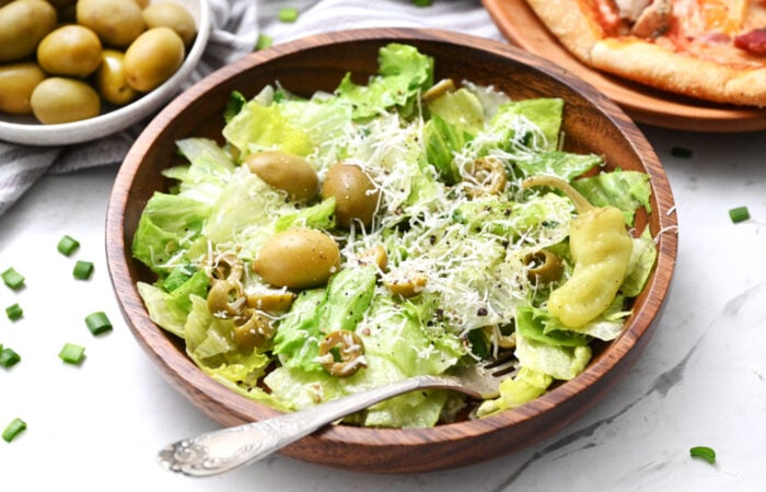 pizza and salad with olives
