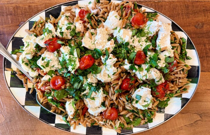 a platter of Summer Orzo Salad With Burrata