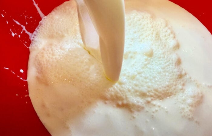 pouring cream in a bowl