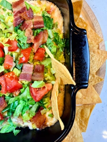 a sturdy chip in a hot bacon dip