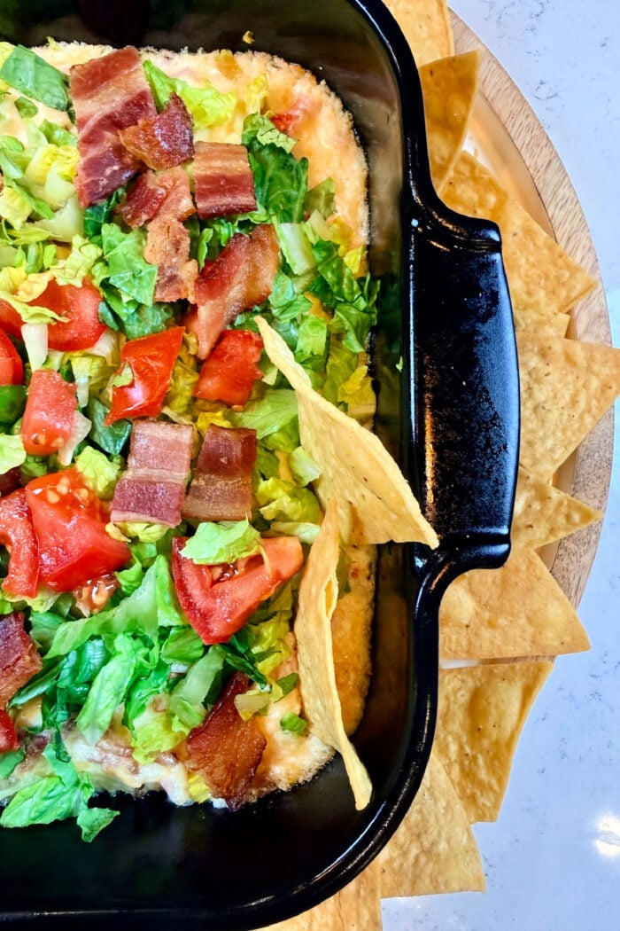 a sturdy chip in a hot bacon dip