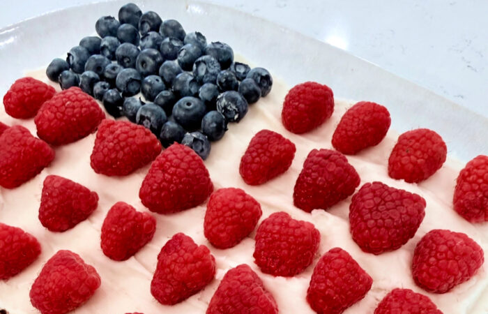 fresh berries on a flag cake for 4th July