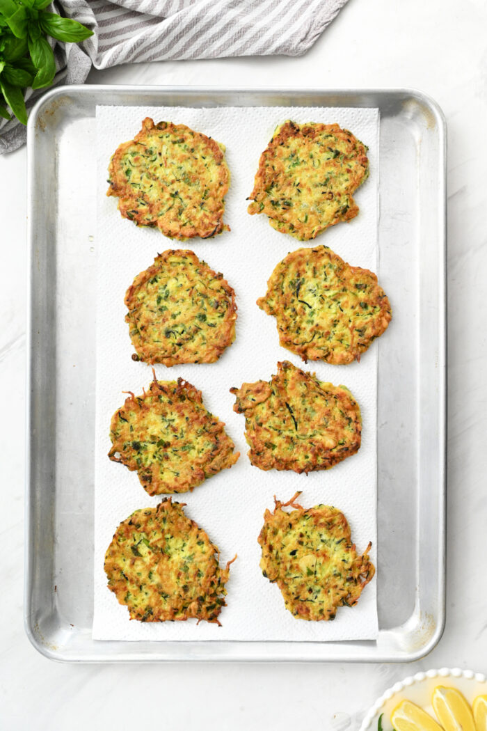 Zucchini Ricotta Fritters on baking sheet