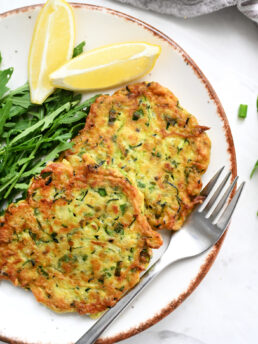 Zucchini Ricotta Fritters on plate