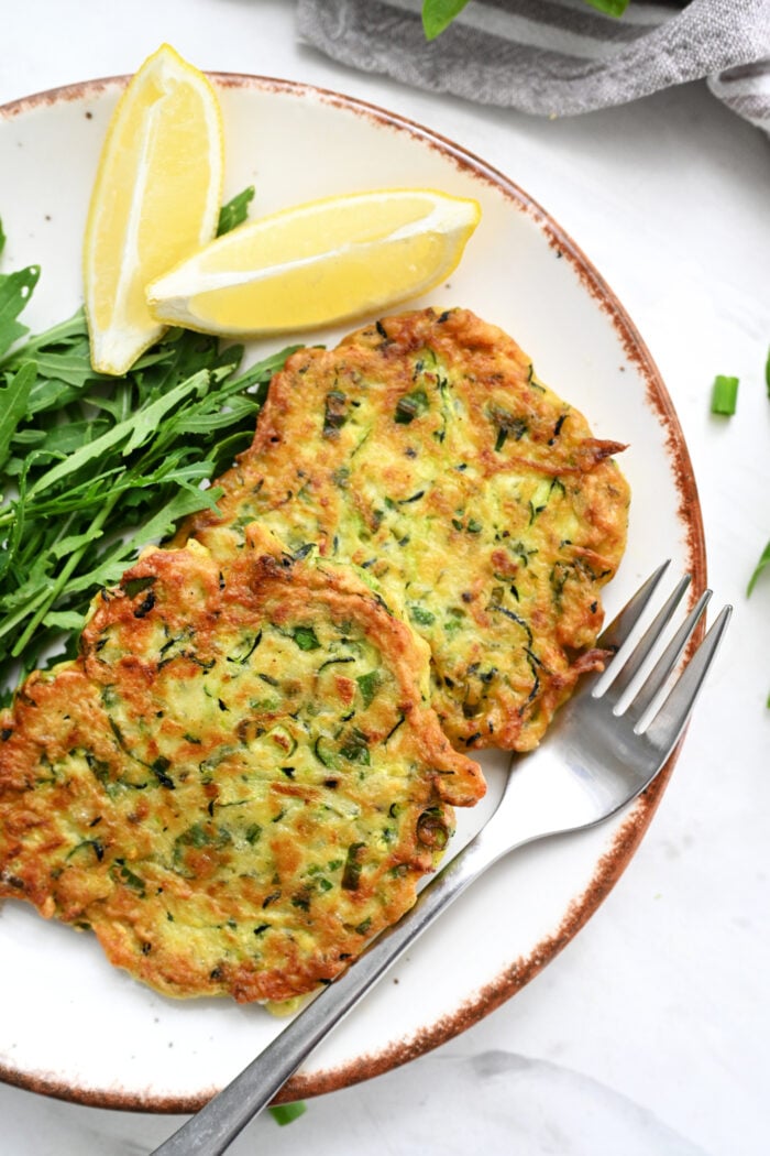 Zucchini Ricotta Fritters on plate