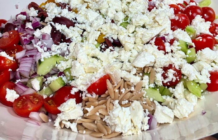 crumbled cheese on salad